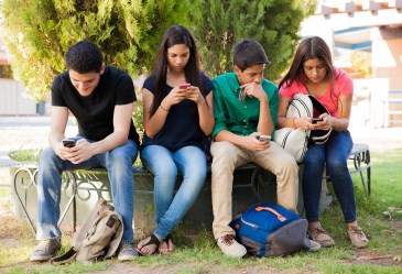 teens busy with smart phones