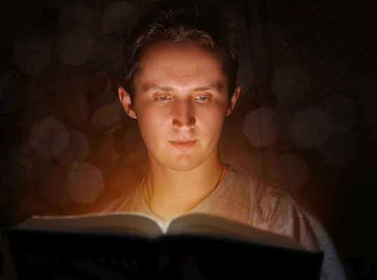 man reading the Bible