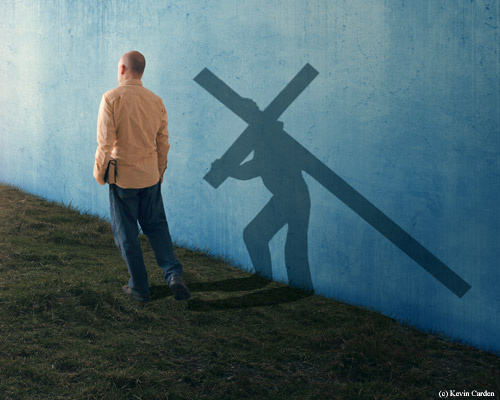 man walking past cross by
                  Kevin Carden