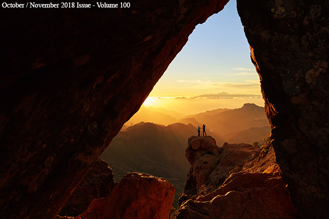 couple viewing
                  sunrise in canyon