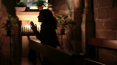 woman praying in
                  church