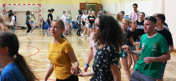 Kairos youth learn a Belgian folk
                              dance