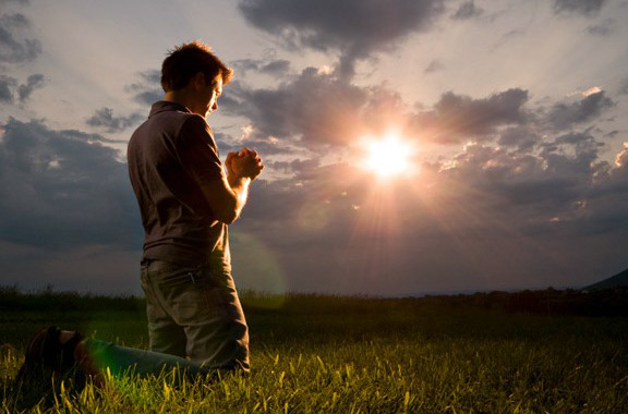 kneeling in
                  prayer